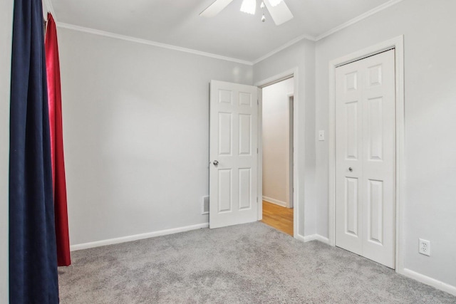 35790 N Wilson Rd, Ingleside, IL 60041 - unfurnished bedroom featuring carpet, ornamental molding, baseboards, a closet, and a ceiling fan