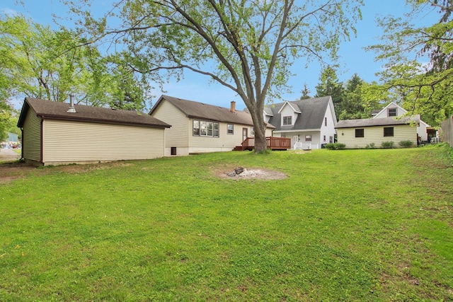 35790 N Wilson Rd, Ingleside, IL 60041 - rear view of property featuring a lawn, a wooden deck, and an outdoor structure