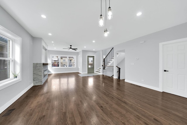 2613 Kenilworth Ave, Berwyn, IL 60402 - unfurnished living room featuring stairway, plenty of natural light, ceiling fan, baseboards, and recessed lighting