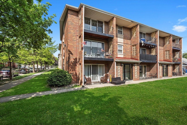 6436 W 64th Pl Unit A3, Chicago, IL 60638 - back of property with brick siding and a yard