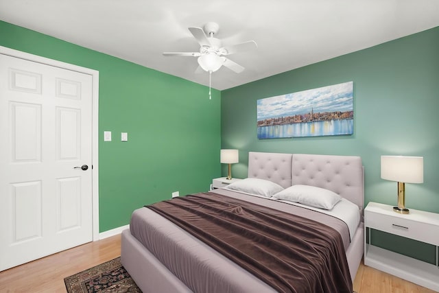 6436 W 64th Pl Unit A3, Chicago, IL 60638 - bedroom with wood finished floors, ceiling fan, and baseboards