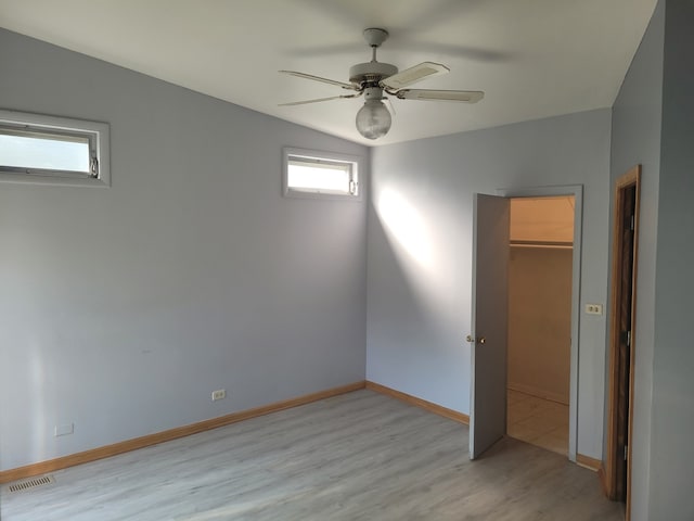 864 Sumac Rd, Highland Park, IL 60035 - unfurnished bedroom featuring light wood-style floors, ceiling fan, baseboards, and a closet