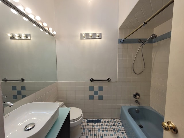 864 Sumac Rd, Highland Park, IL 60035 - bathroom featuring tile walls, toilet, shower / bathtub combination, vanity, and tile patterned flooring