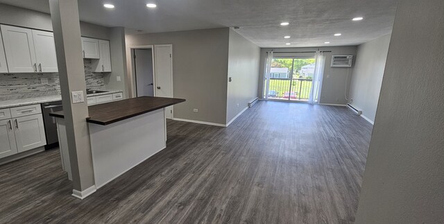 802 E Old Willow Rd Unit 2-210, Prospect Heights, IL 60070 - kitchen with wooden counters, a baseboard heating unit, dark wood-style floors, open floor plan, and a wall unit AC