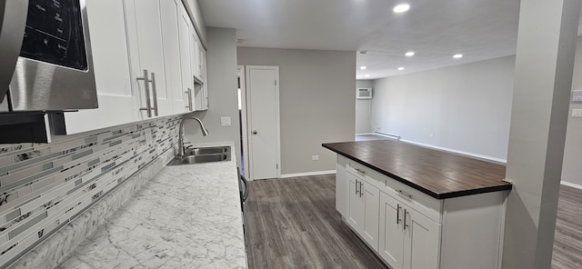 802 E Old Willow Rd Unit 2-210, Prospect Heights, IL 60070 - kitchen with a sink, tasteful backsplash, recessed lighting, white cabinets, and butcher block counters