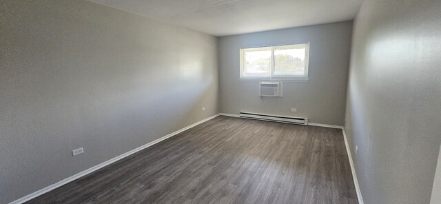 802 E Old Willow Rd Unit 2-210, Prospect Heights, IL 60070 - empty room featuring baseboard heating, dark wood-style floors, a wall unit AC, and baseboards