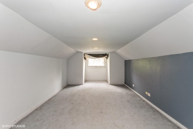 5000 N Kenneth Ave, Chicago, IL 60630 - additional living space with light colored carpet, lofted ceiling, and baseboards