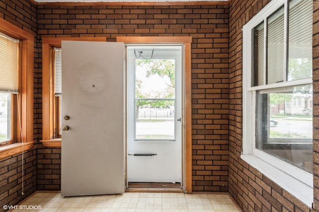 5000 N Kenneth Ave, Chicago, IL 60630 - entryway featuring healthy amount of natural light, light floors, and brick wall