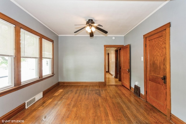 5000 N Kenneth Ave, Chicago, IL 60630 - unfurnished room featuring wood finished floors, a ceiling fan, baseboards, and ornamental molding
