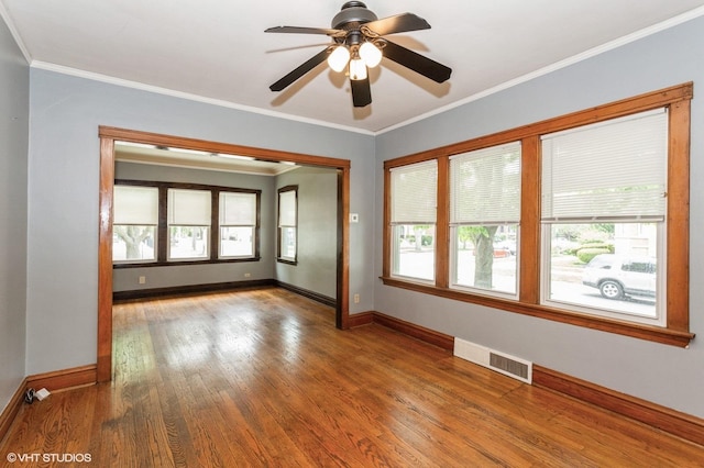 5000 N Kenneth Ave, Chicago, IL 60630 - empty room featuring wood finished floors, baseboards, crown molding, and ceiling fan