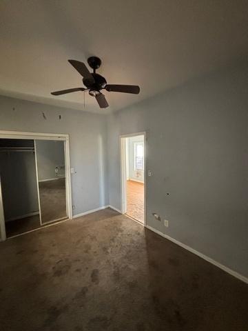 8370 S Baker Ave, Chicago, IL 60617 - unfurnished bedroom with a closet, carpet flooring, baseboards, and ceiling fan