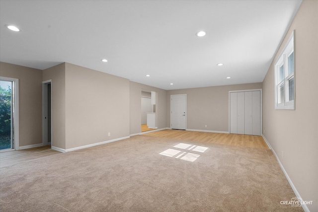 304 John St, North Aurora, IL 60542 - empty room with light colored carpet, baseboards, and recessed lighting