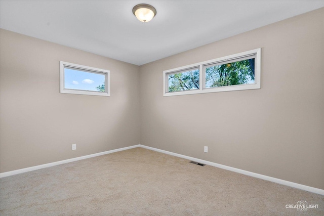 304 John St, North Aurora, IL 60542 - empty room with carpet floors and baseboards