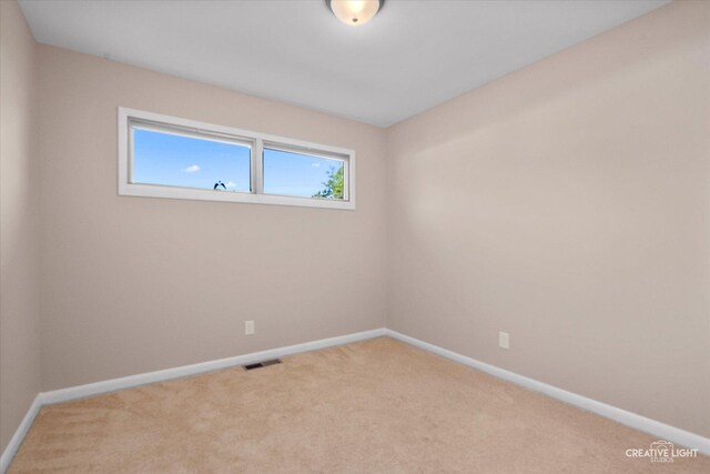 304 John St, North Aurora, IL 60542 - carpeted empty room with baseboards