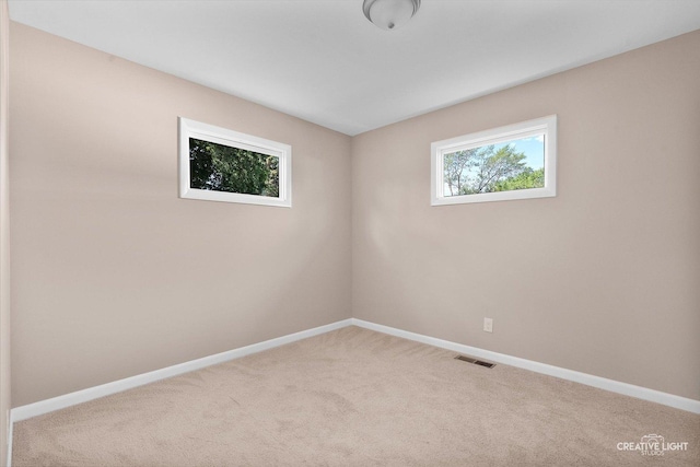 304 John St, North Aurora, IL 60542 - carpeted empty room with baseboards