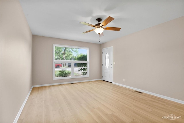 304 John St, North Aurora, IL 60542 - spare room featuring ceiling fan, light wood-style floors, and baseboards