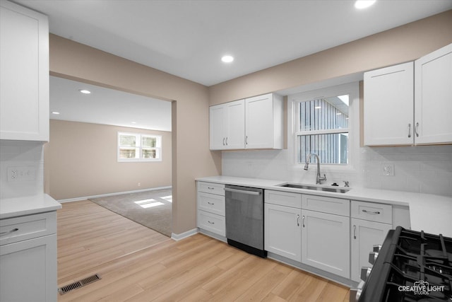 304 John St, North Aurora, IL 60542 - kitchen featuring dishwasher, a sink, decorative backsplash, light wood finished floors, and recessed lighting