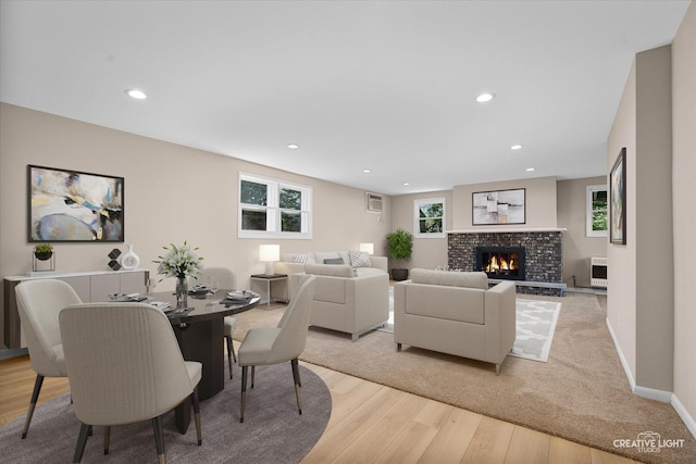 304 John St, North Aurora, IL 60542 - dining room featuring light wood finished floors, recessed lighting, a fireplace, and baseboards