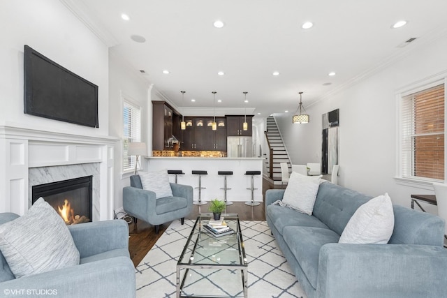 3737 N Clifton Ave Unit 3, Chicago, IL 60613 - living area with crown molding, stairs, light wood-style floors, recessed lighting, and a premium fireplace