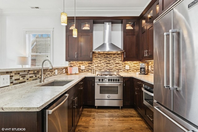 3737 N Clifton Ave Unit 3, Chicago, IL 60613 - kitchen featuring high quality appliances, wall chimney range hood, a sink, dark brown cabinetry, and ornamental molding