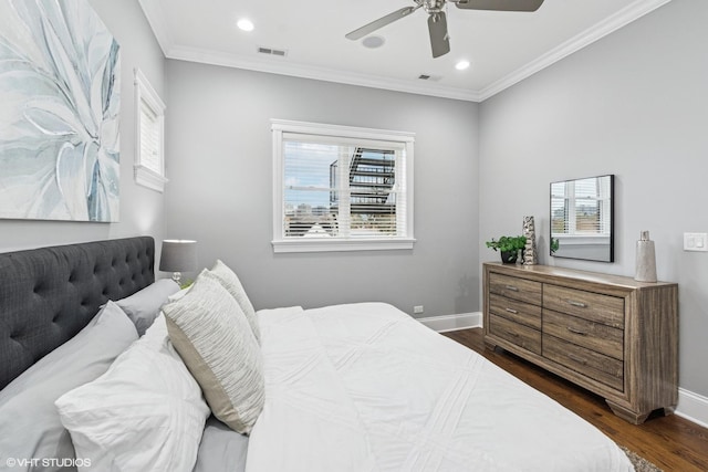 3737 N Clifton Ave Unit 3, Chicago, IL 60613 - bedroom with dark wood-style flooring, multiple windows, baseboards, recessed lighting, and ornamental molding