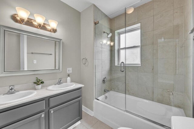 1438 W Roscoe St Unit 3, Chicago, IL 60657 - bathroom with combined bath / shower with glass door, double vanity, and tile patterned floors
