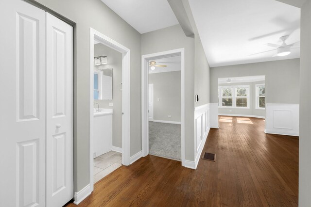 9028 S Ada St, Chicago, IL 60620 - hallway featuring dark wood finished floors and wainscoting