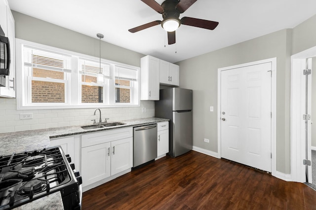 9028 S Ada St, Chicago, IL 60620 - kitchen with appliances with stainless steel finishes, a sink, tasteful backsplash, and dark wood-style floors
