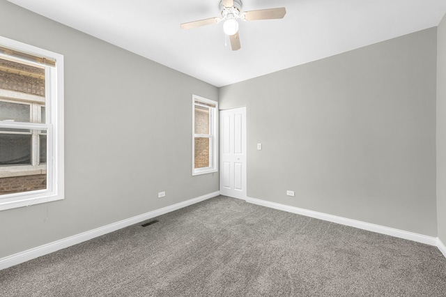 9028 S Ada St, Chicago, IL 60620 - empty room with carpet, a ceiling fan, and baseboards