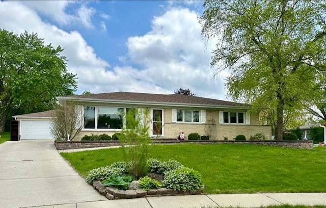 single story home featuring a garage, a front yard, brick siding, and concrete driveway