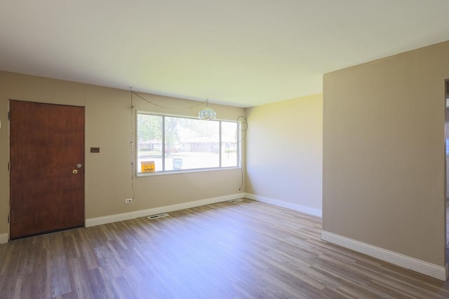 885 163rd St, Calumet City, IL 60409 - empty room featuring wood finished floors and baseboards
