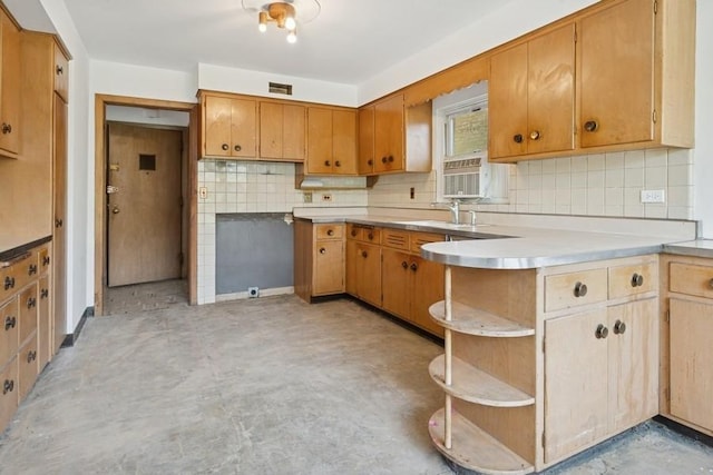 1214 Hull Ter, Evanston, IL 60202 - kitchen featuring concrete floors, open shelves, a sink, a peninsula, and decorative backsplash
