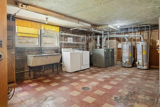 1214 Hull Ter, Evanston, IL 60202 - below grade area featuring tile patterned floors, gas water heater, and separate washer and dryer