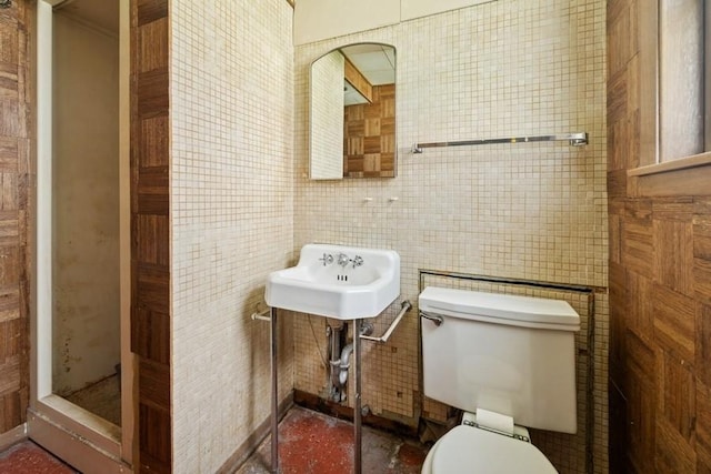 1214 Hull Ter, Evanston, IL 60202 - bathroom featuring toilet, tile walls, and a sink