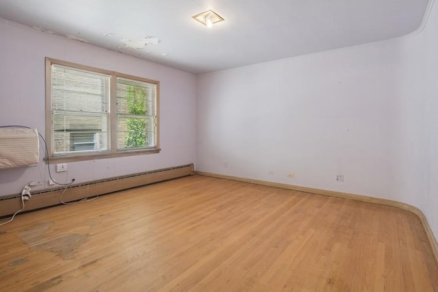 1214 Hull Ter, Evanston, IL 60202 - spare room with light wood-type flooring, a baseboard radiator, baseboards, and crown molding