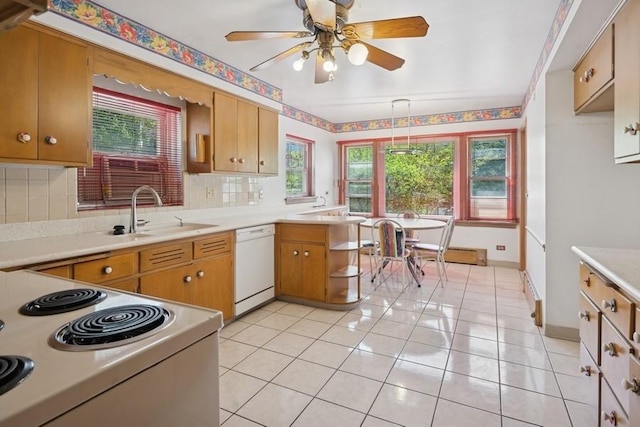 1214 Hull Ter, Evanston, IL 60202 - kitchen featuring white appliances, a sink, light countertops, a ceiling fan, and backsplash