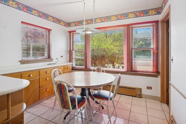 1214 Hull Ter, Evanston, IL 60202 - dining area featuring light tile patterned floors and baseboard heating