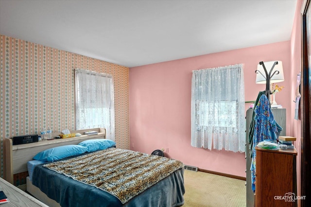 859 N Gladstone Ave, Aurora, IL 60506 - bedroom with light carpet and baseboards