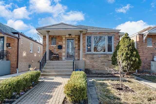 6104 N Kimball Ave, Chicago, IL 60659 - view of front of property with a porch and stone siding
