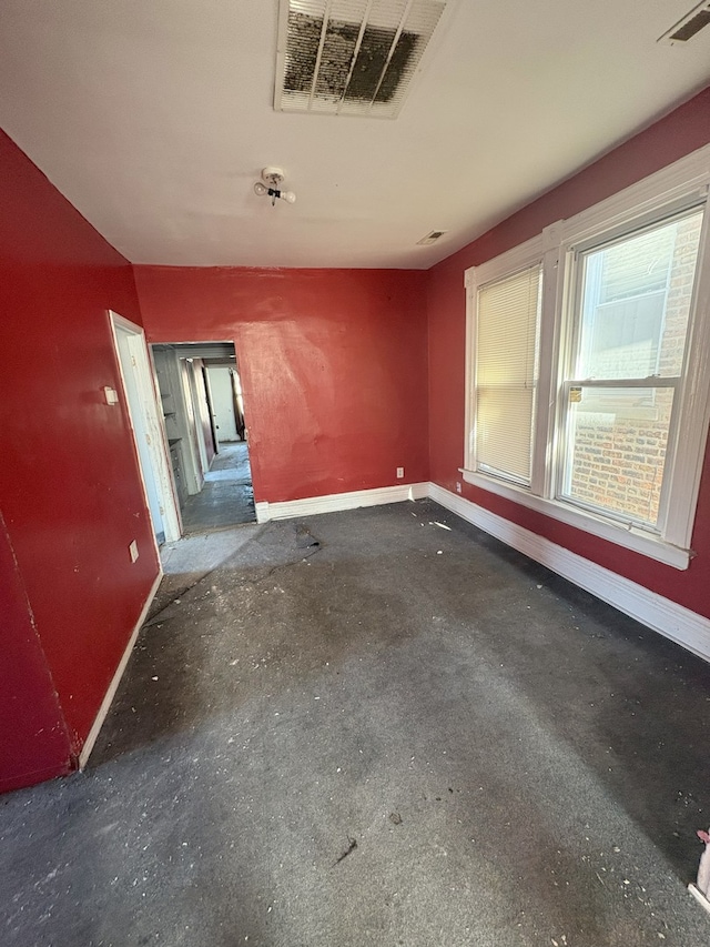empty room with baseboards