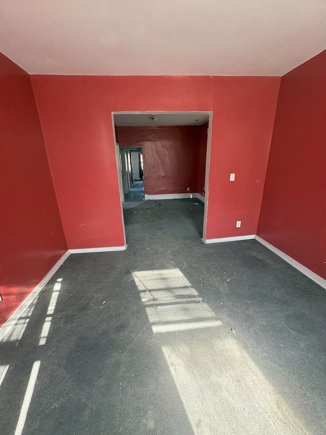 spare room with carpet floors and baseboards