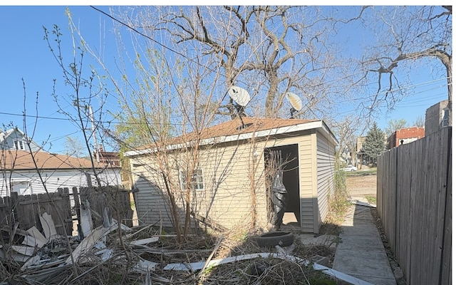 view of home's exterior with fence