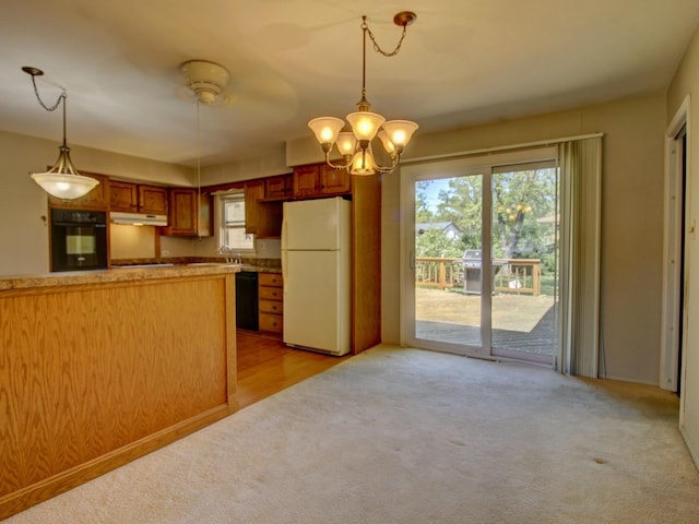 3S135 Cherrywood Ln, Glen Ellyn, IL 60137 - kitchen featuring black appliances, light carpet, under cabinet range hood, a sink, and a chandelier