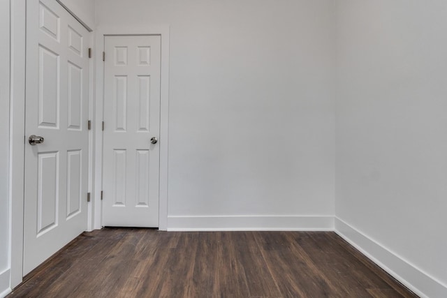 1922 Harvey Ave, Berwyn, IL 60402 - unfurnished room with dark wood-style flooring and baseboards