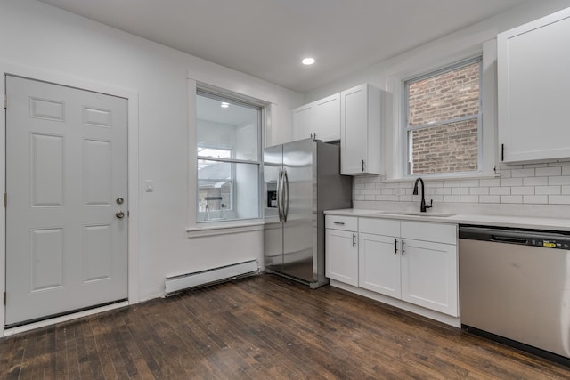 1922 Harvey Ave, Berwyn, IL 60402 - kitchen featuring stainless steel appliances, baseboard heating, a sink, white cabinetry, and recessed lighting