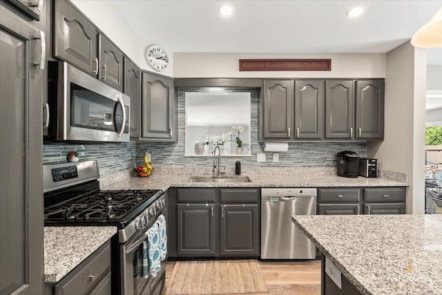 120 3 Oaks Rd, Cary, IL 60013 - kitchen featuring appliances with stainless steel finishes, a sink, decorative backsplash, gray cabinetry, and recessed lighting