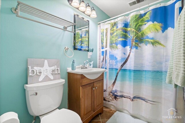 120 3 Oaks Rd, Cary, IL 60013 - bathroom featuring tile patterned flooring, toilet, vanity, and curtained shower