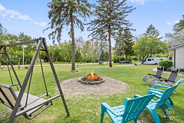 120 3 Oaks Rd, Cary, IL 60013 - view of green lawn featuring a fire pit