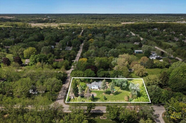 120 3 Oaks Rd, Cary, IL 60013 - aerial view of property and surrounding area featuring a heavily wooded area and property boundaries highlighted