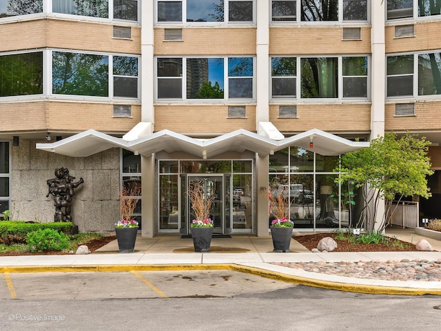 555 W Cornelia Ave Unit 1405, Chicago, IL 60657 - view of building exterior with uncovered parking